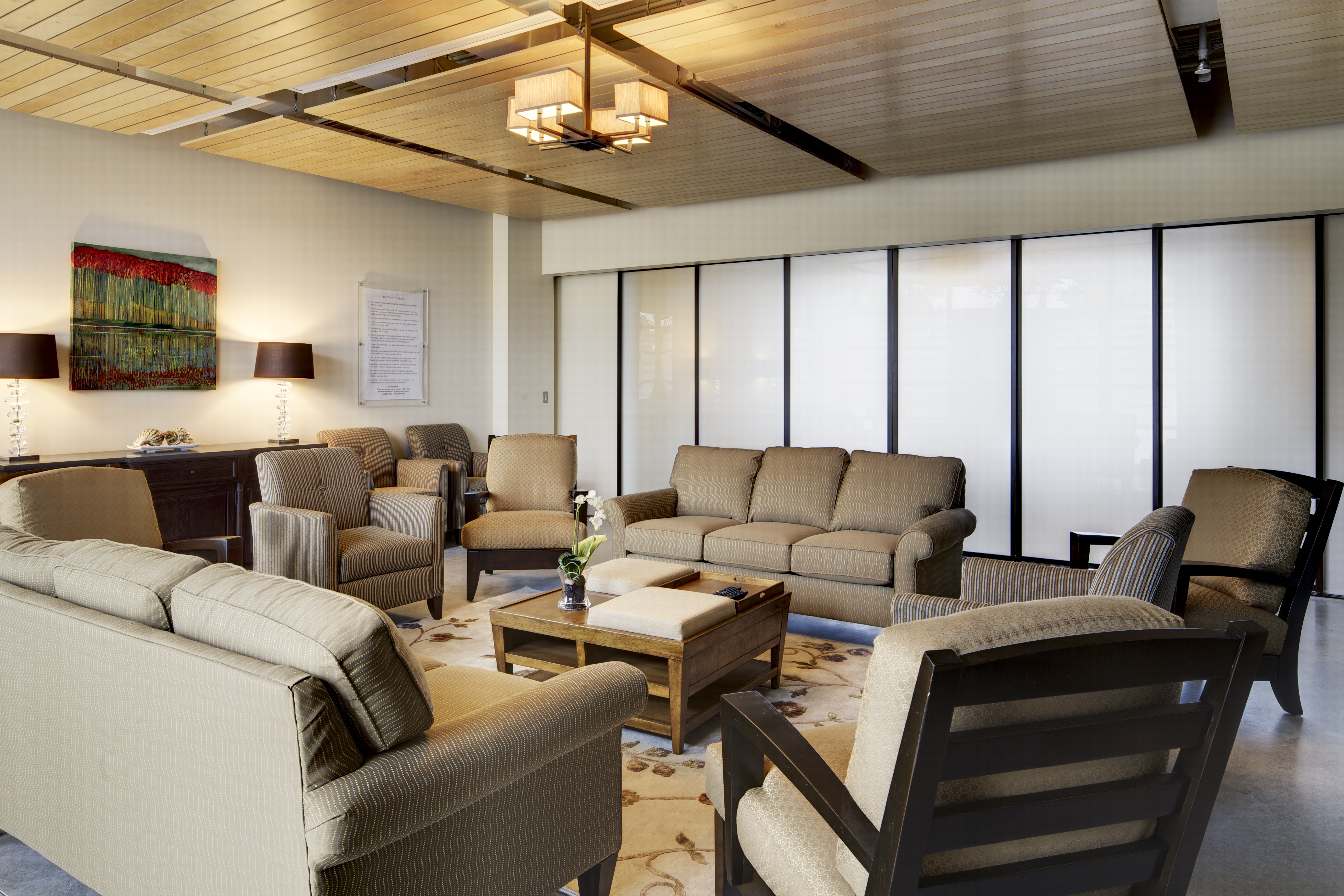 A view of the Naples group room with comfortable chairs and sofas