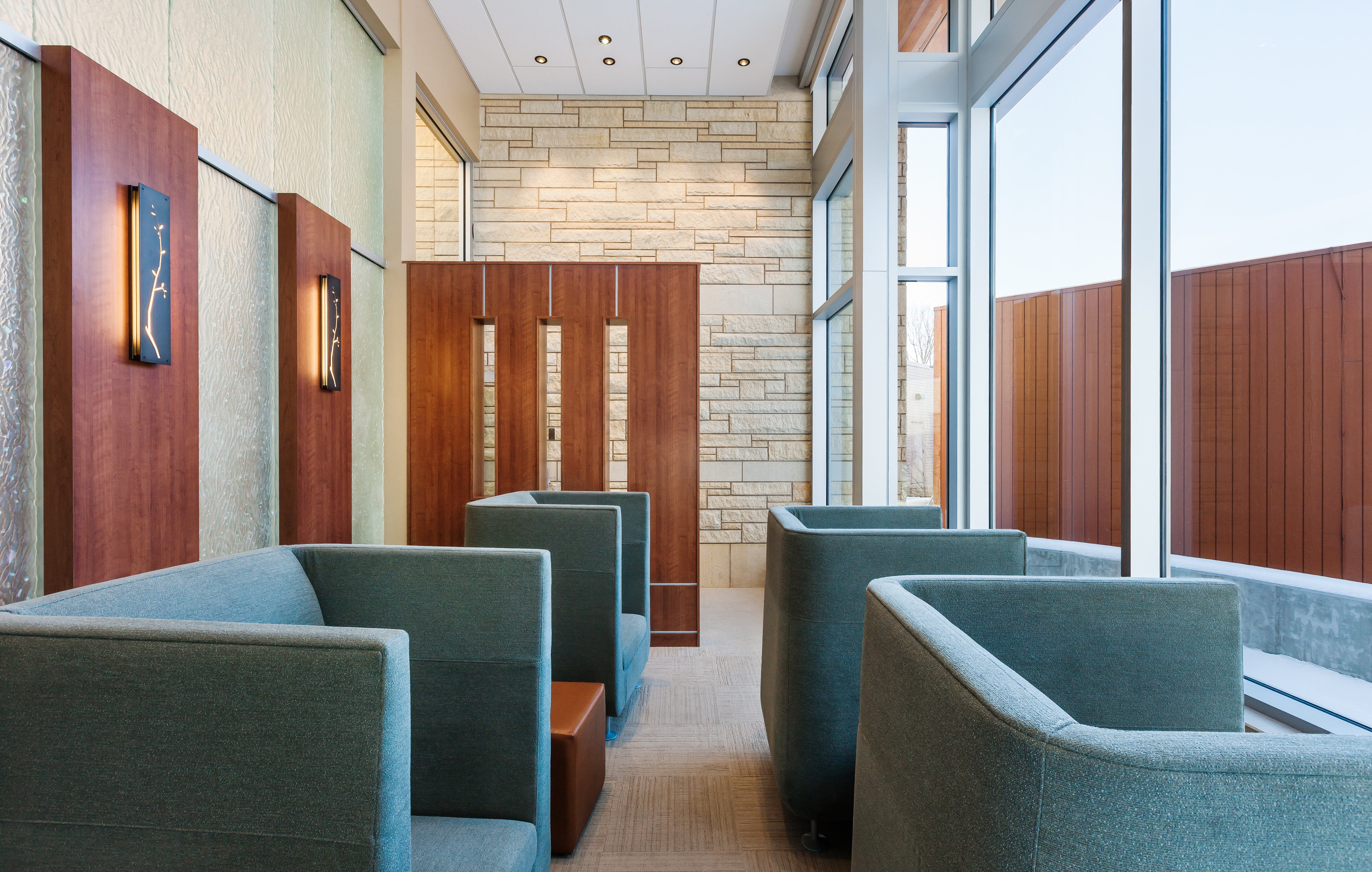 The inside of the Plymouth meditation room with comfortable light blue chairs